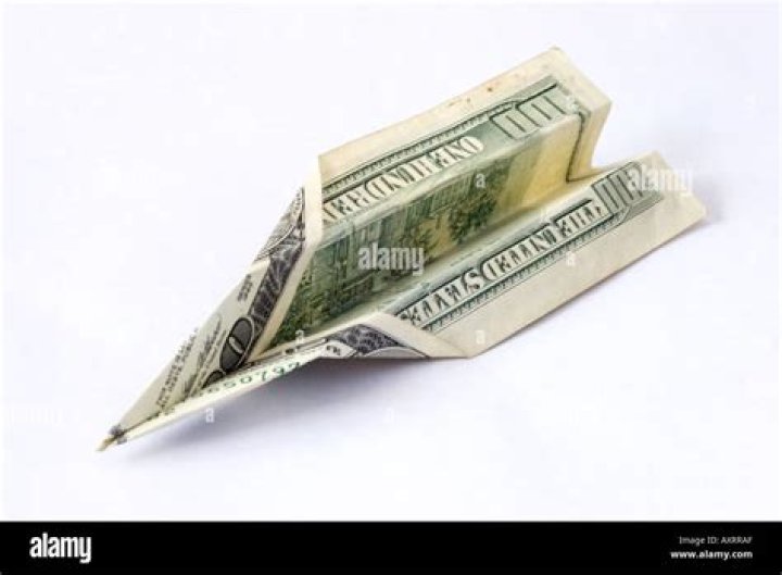 $100 bill folded into paper plane