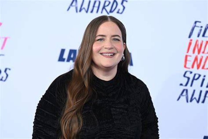 Aidy Bryant smiles during a Writer's Guild of America protest.