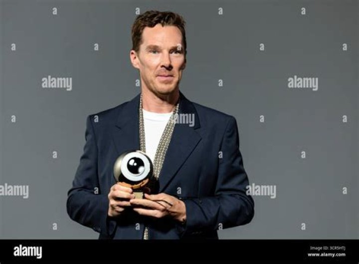 Benedict Cumberbatch receiving an award Benedict Cumberbatch receiving an award