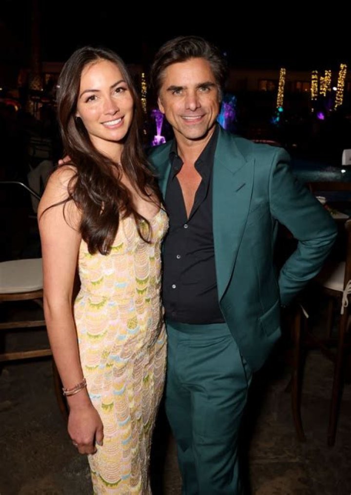 Caitlin McHugh and John Stamos Caitlin McHugh and John Stamos