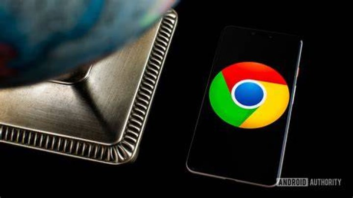 Chrome logo on smartphone next to globe Chrome logo on smartphone next to globe