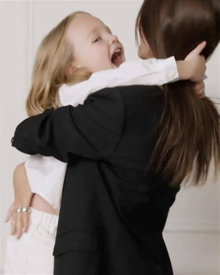 Emily Ratajkowski hugging her son.