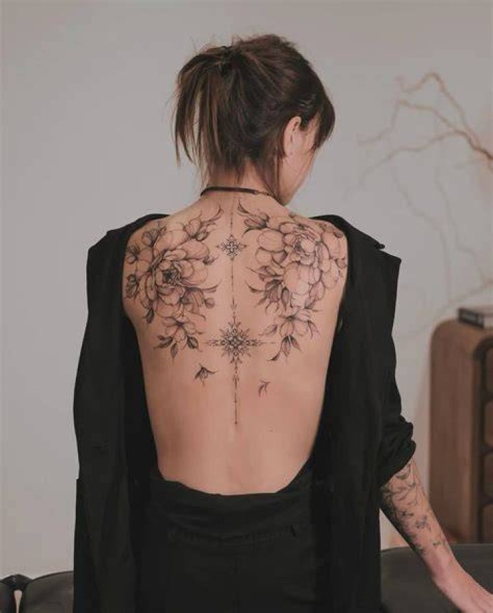 feminine back tattoo idea