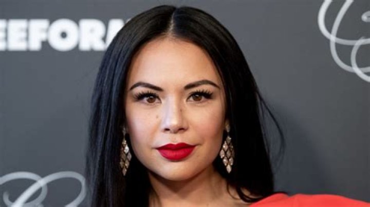Janel Parrish smiling