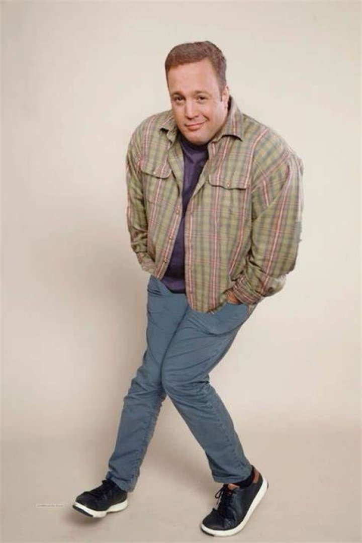 John Reilly smiling and posing