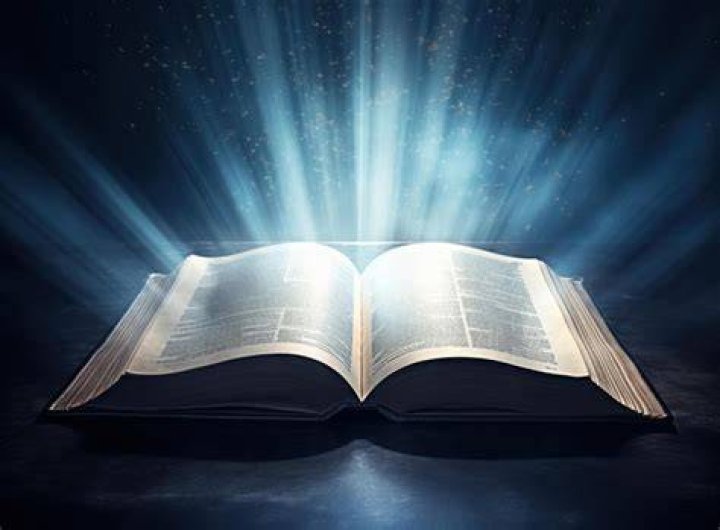 Kris8an with an open Bible in his hand Kris8an with an open Bible in his hand