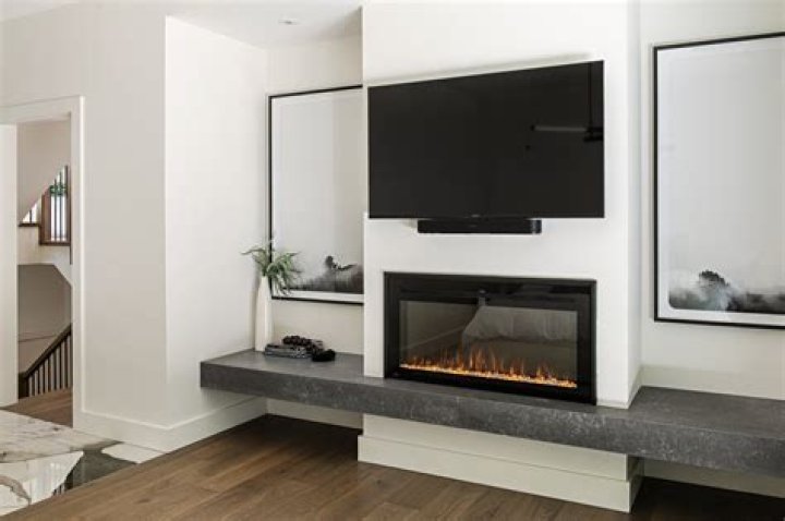 Large screen TV mounted on wall stock Large screen TV mounted on wall stock