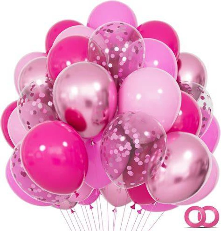 Leah McSweeney with pink balloons and a pink Chanel bag