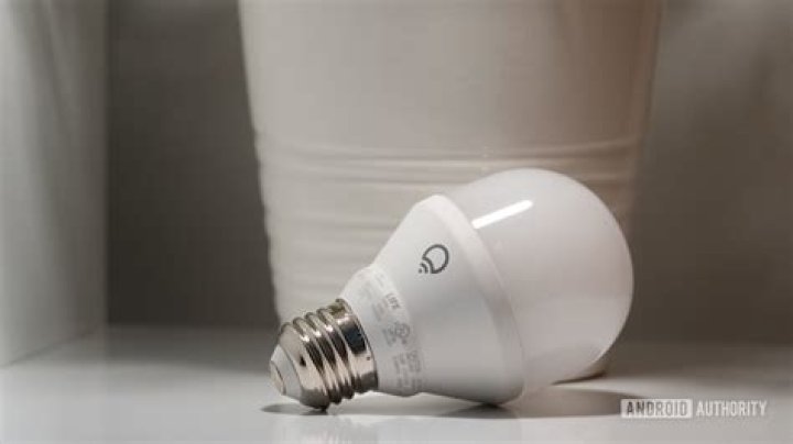 lifx bulb on white surface in front of plant pot 2 lifx bulb on white surface in front of plant pot 2