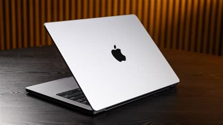 Mac and laptop on desk