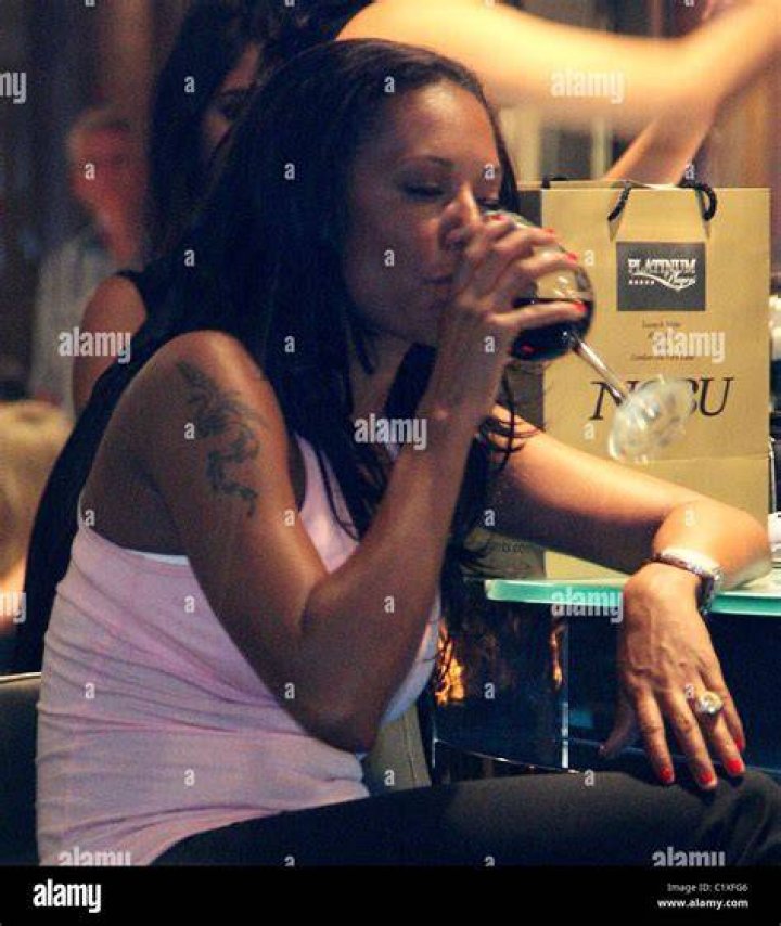 Mel B wearing a pink dress on a red carpet
