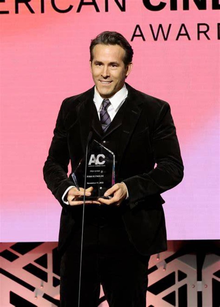 Nicolas Cage receiving an award Nicolas Cage receiving an award
