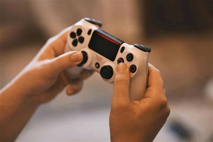 sony ps4 playstation 4 controller Person Holding Sony Ps4 Controller