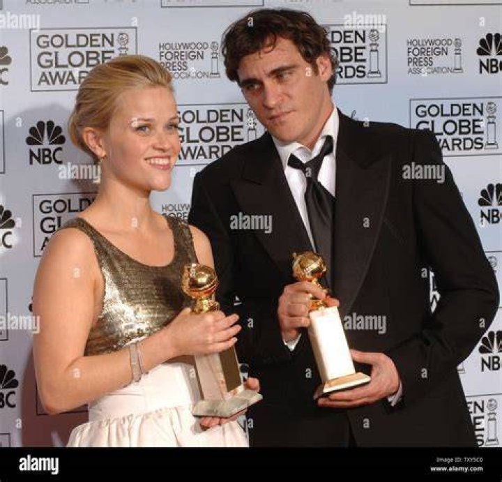Reese Witherspoon and Joaquin Phoenix about to kiss