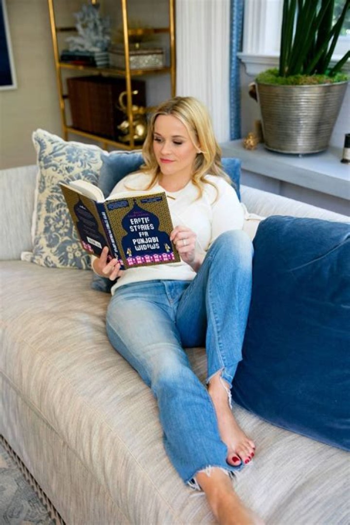 Reese Witherspoon reading a book