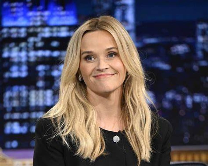 Reese Witherspoon speaking next to Hello Sunshine logo