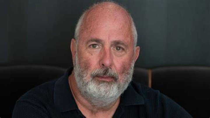 Roger Michell looking at camera