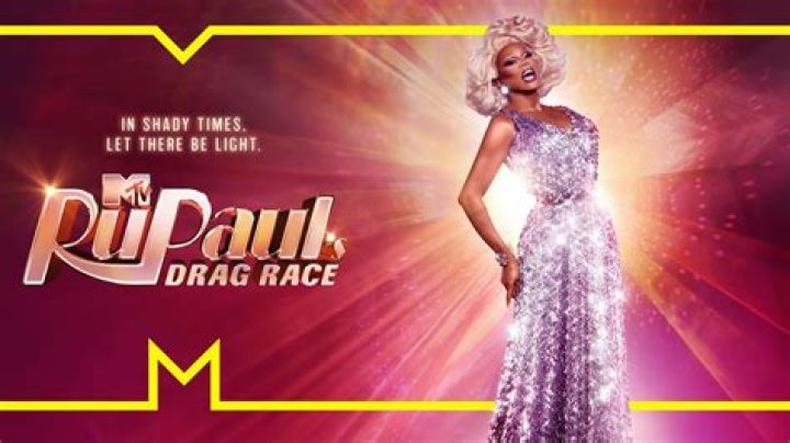 RuPaul in a sequinned black and pink blazer