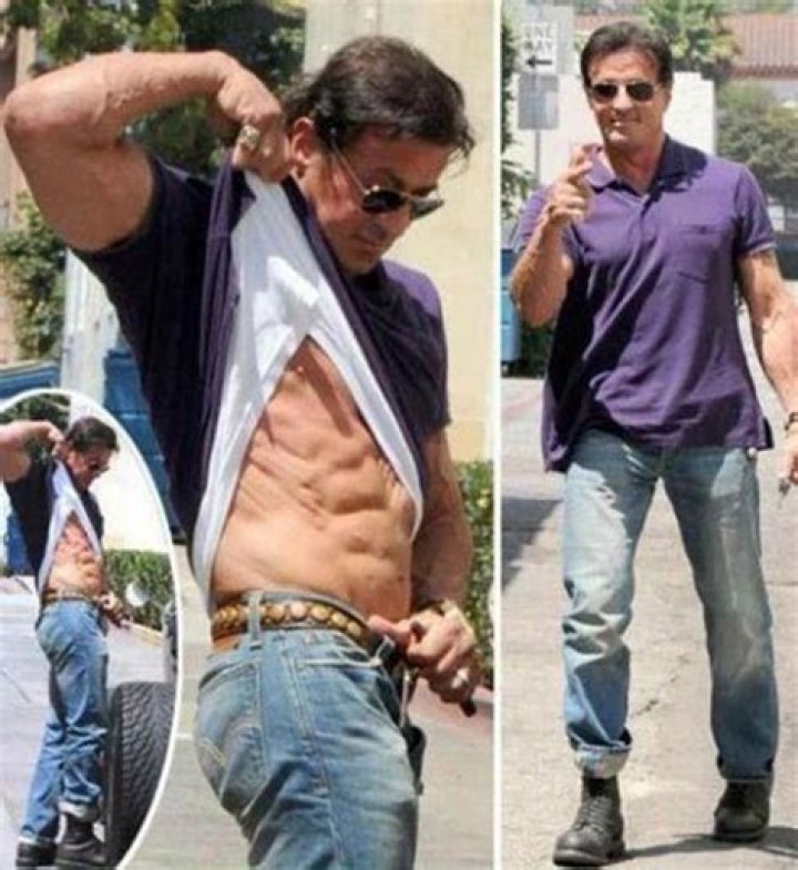 Sylvester Stallone showing off his arm tattoo.