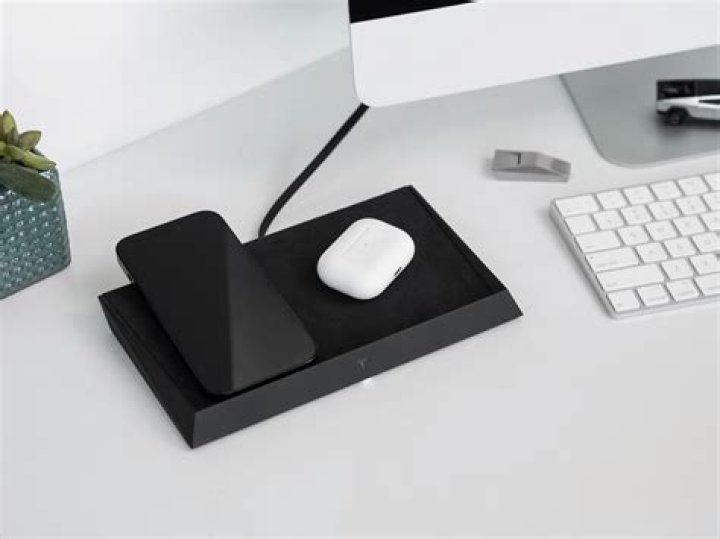 The Tesla Wireless Charger, complete with company logo.