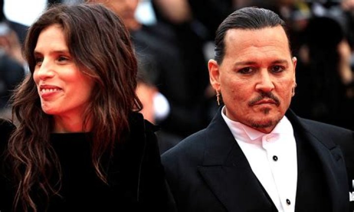 US actor Johnny Depp (R) and his wife Amber Heard arrive at a court in the Gold Coast on April 18, 2016. Depp and Heard arrived at an Australian court April 18 over Heard's alleged illegal importation of their two Yorkshire terrier dogs Boo and Pistol into the country in a private jet in 2015