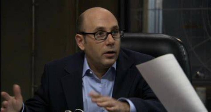 Willie Garson wearing glasses and smiling